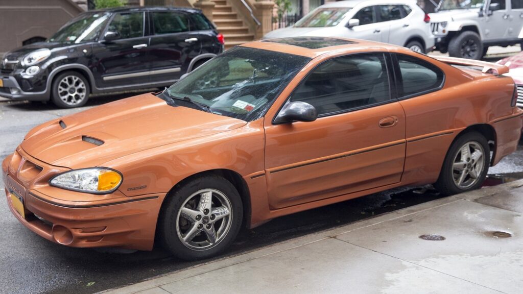 What Engine Powers the 2003 Pontiac Grand Am GT and What Is Its Current Value?